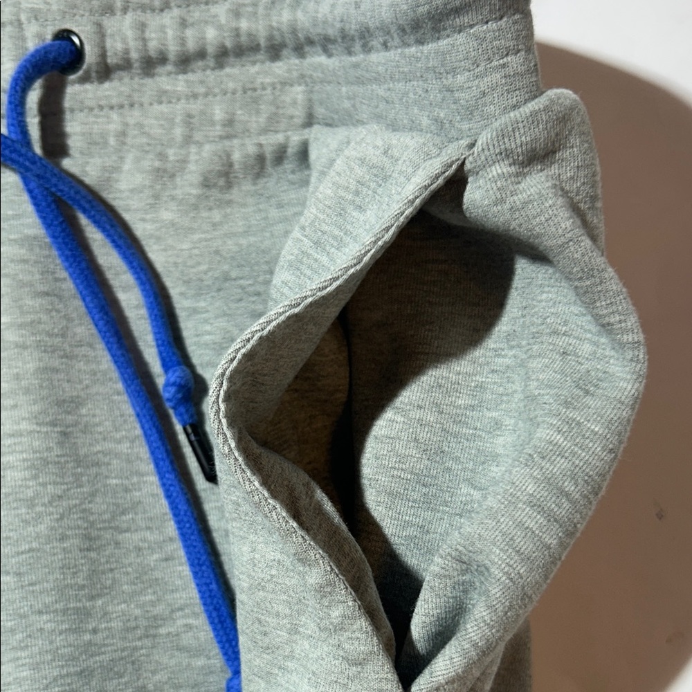 Nike Men’s Light Gray Athletic Shorts with Blue Drawstring and Zipper Pocket - Picture 5 of 7